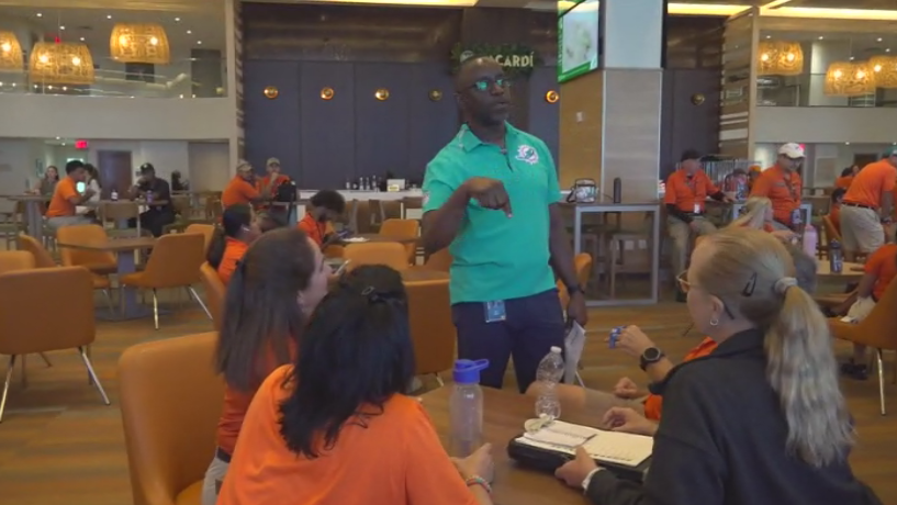 Miami Dade College professor finds his passion with side job at Hard Rock Stadium — CBS Miami, Boca Raton Arts news